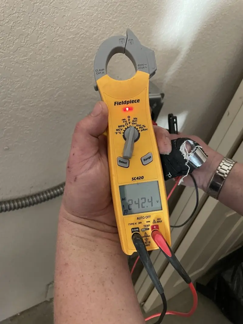 Voltage testing with clamp meter during Whole House Surge Protector in Hempstead